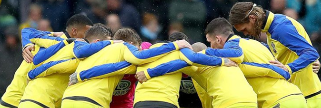 Southampton players in a team huddle before a match